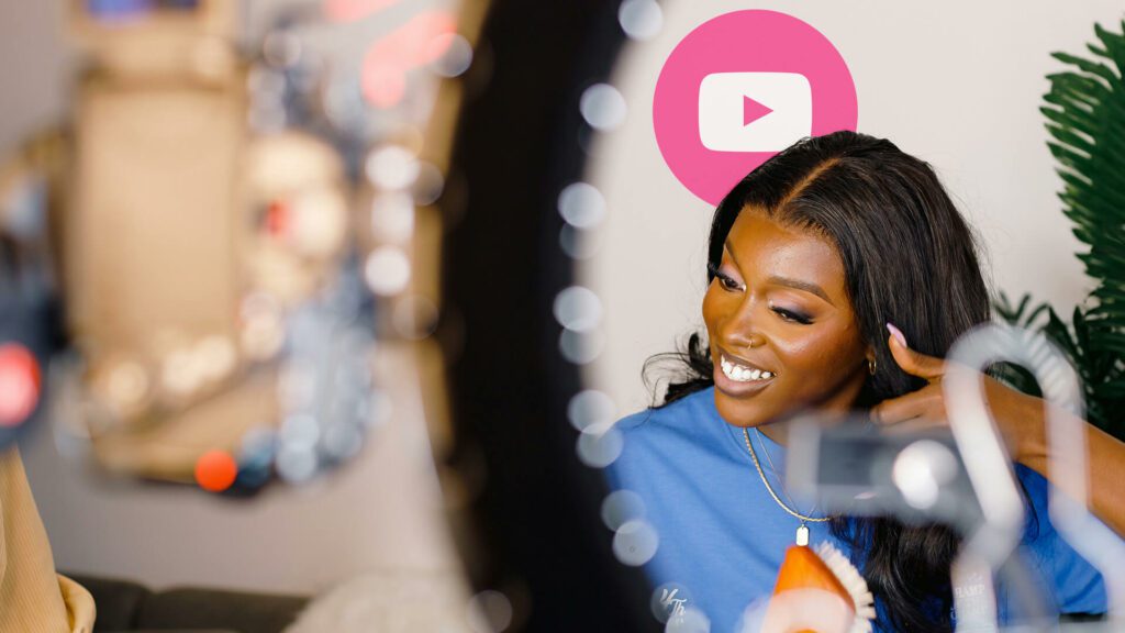 Black woman does her makeup and records on tripod for YouTube